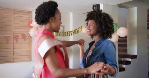 Happy Diverse Female Couple Celebrating Birthday at Home
