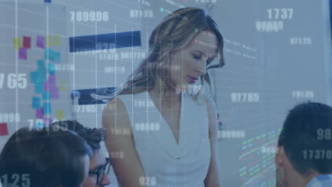 Business Professionals in Meeting with Financial Data Overlay