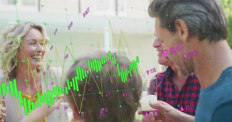 Smiling friends holding drinks on patio showing augmented candlestick finance charts