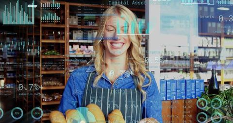 Smiling Baker Holding Fresh Round Loaves with Digital Data Overlay for Retail Tech Concept