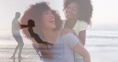 Happy African American Family Celebrating Summer on Beach