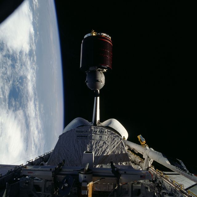 Space Shuttle Discovery Deploying Telstar Satellite Over Earth - Download Free Stock Photos Pikwizard.com