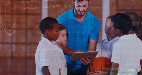 Teacher explaining tech concepts to diverse students with tablet