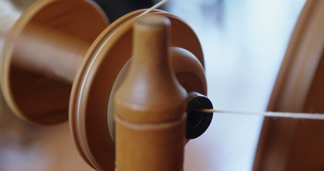 Close-Up of Wooden Spinning Wheel with Thread in Motion - Download Free Stock Images Pikwizard.com