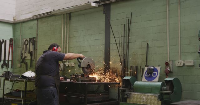 Engineer Using Angle Grinder Creating Sparks in Workshop - Download Free Stock Images Pikwizard.com