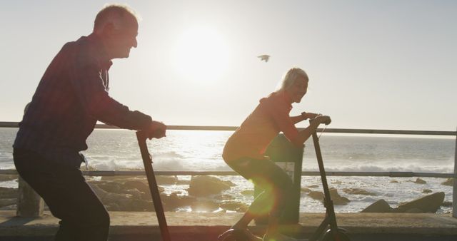 Seniors Riding Electric Scooters by Ocean at Sunset - Download Free Stock Images Pikwizard.com