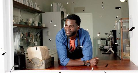 Barista organizing cafe counter with warm invitation