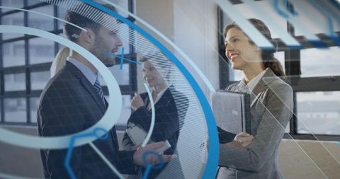 Business professionals networking with digital interface overlay in modern glass office