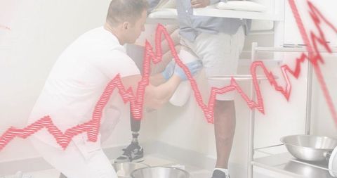 Clinician fitting prosthetic leg for patient during rehabilitation consultation