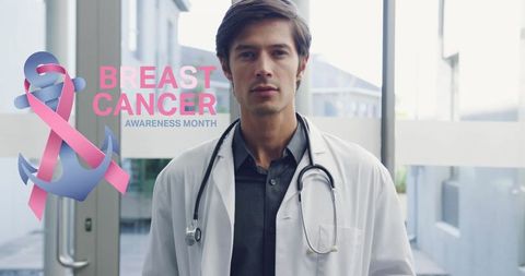 Male Doctor Promotes Breast Cancer Awareness with Pink Ribbon