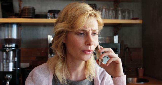 Businesswoman Talking on Mobile Phone in Coffee Shop - Download Free Stock Images Pikwizard.com