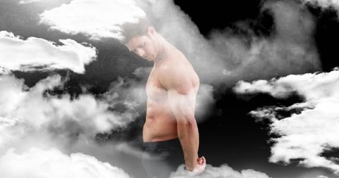 Confident Man Standing Among Cloudy Atmosphere