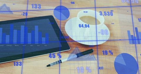 Analyzing tablet financial charts with coffee and pen, business data overlays and graphs