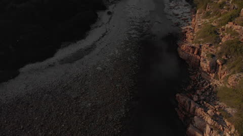 Aerial View of Rocky Sea Coast at Dusk