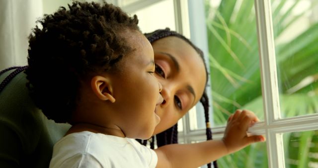 Mother and Child Enjoying Window View - Download Free Stock Images Pikwizard.com