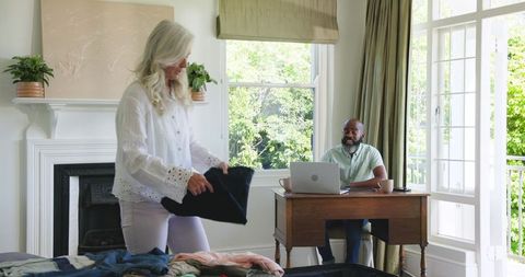Couple Engaging in Modern Digital House Ambiance with Tablet