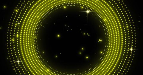 Dynamic spinning yellow light circles on black background