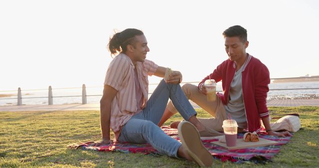 Two Friends Enjoying Outdoor Picnic by the Water - Download Free Stock Images Pikwizard.com