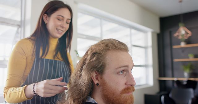 Experienced Hairstylist Trimming Hair of Redhead Man in Barbershop - Download Free Stock Images Pikwizard.com