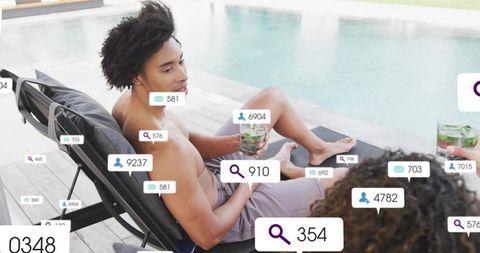 Relaxing shirtless man lounging poolside with social media badges and cooling mint drink