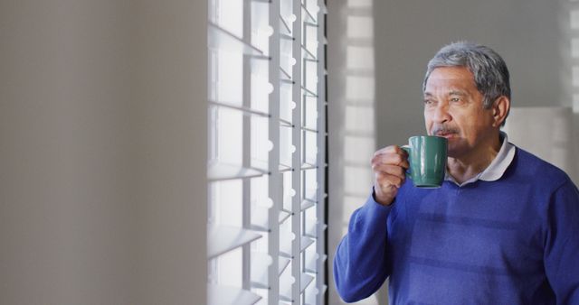 Senior Man Drinking Coffee and Looking Out Window in Bright Room - Download Free Stock Images Pikwizard.com