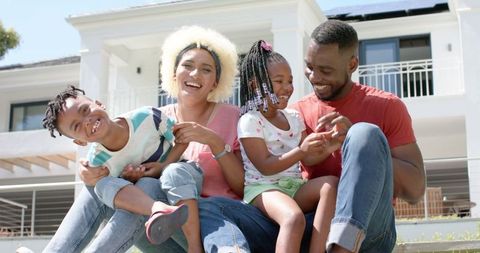 Happy Family Relaxing Outdoors, Creating Lasting Memories