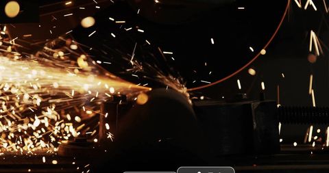 Sparks flying from circular saw blade with notification symbols