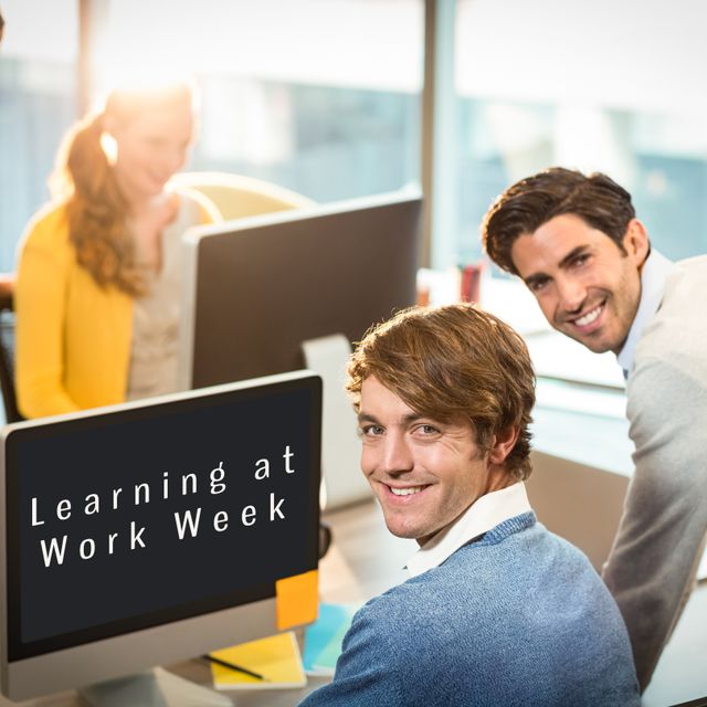 Depicts colleagues in an office engaging in Learning at Work Week. Ideal for promoting corporate training programs, teamwork, and learning initiatives. Suitable for articles on professional development and workplace education.