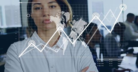 Businesswoman Examining Virtual Data Interfaces in Modern Office