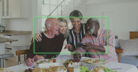 Diverse senior group enjoying meal and social interaction