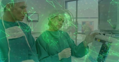 Surgical team monitoring vital signs on tech console in operating room