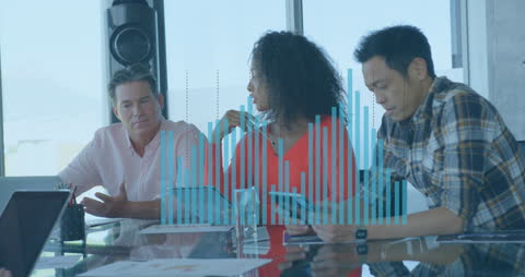 Diverse Colleagues Discussing Analytics in Modern Office Environment