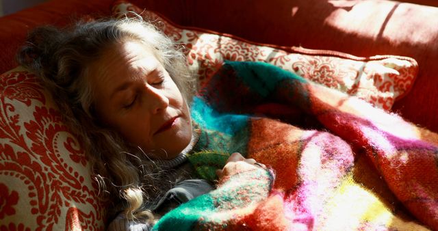 Senior Woman Sleeping Peacefully on Sofa with Colorful Blanket - Download Free Stock Images Pikwizard.com