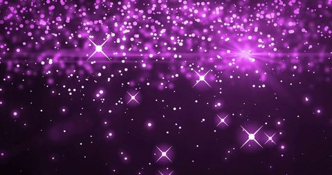 Glowing purple sparkles on black background