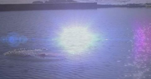 Tranquil Reservoir View with Illuminating Lens Flare