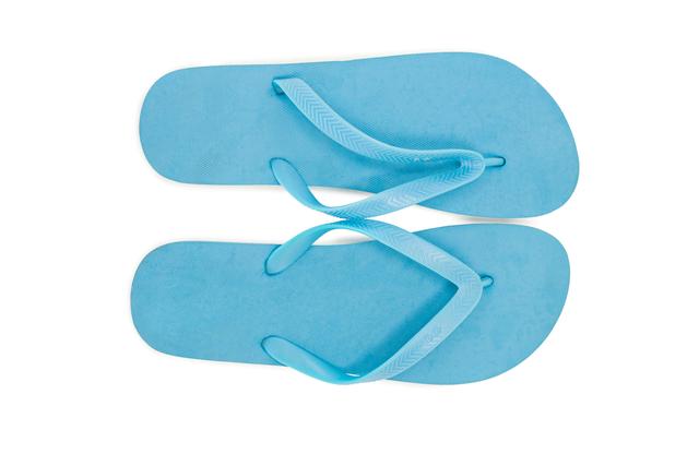 Pair of blue beach flip flop slipper on white background