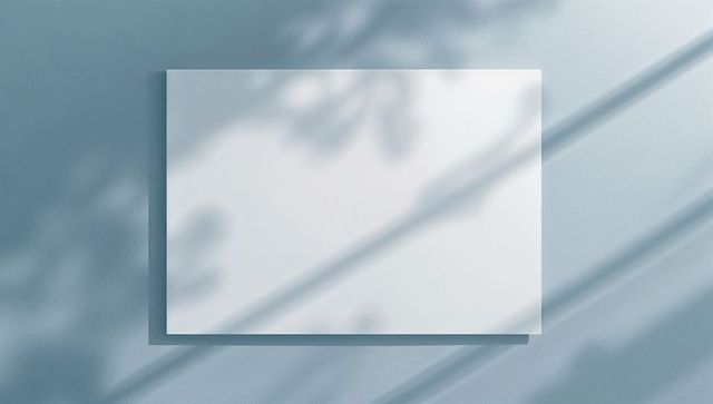 Floating White Board against Teal Wall with Dappled Shadow Effect