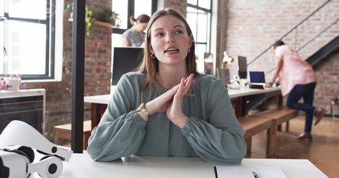Young Professional Woman with Surprised Expression in Modern Office