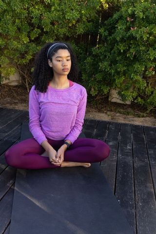 Tranquil meditation on outdoor deck, embracing wellness and mindfulness