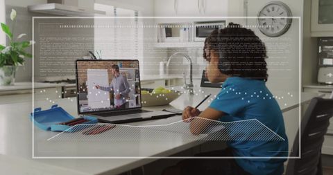 Biracial boy engaged in online learning with digital interface elements