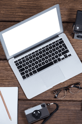 Transparent Screen Laptop with Vintage Cameras on Wooden Background - Download Free Stock Videos Pikwizard.com