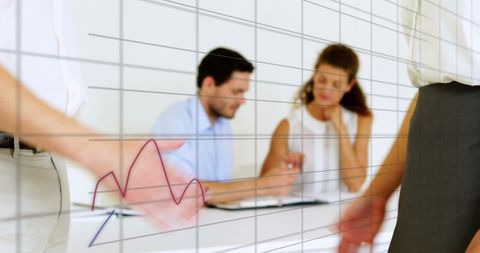 business team analyzing data on interactive display - Download Free Stock Images Pikwizard.com
