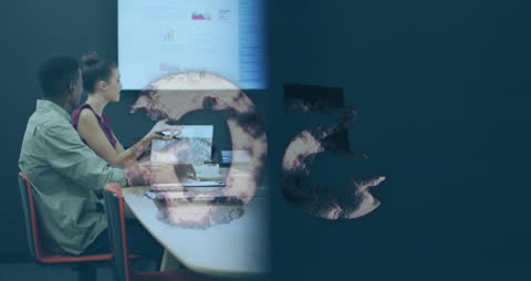 Diverse Colleagues Collaborating in Modern Office with Technology