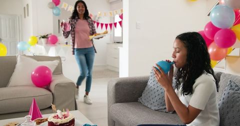 Mother and Daughter Preparing for Festive Family Celebration at Home
