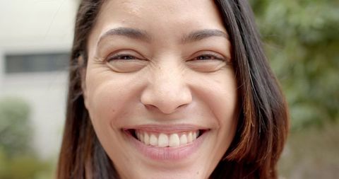 Radiant Smile of Joyful Young Woman Outdoors, Slow Motion