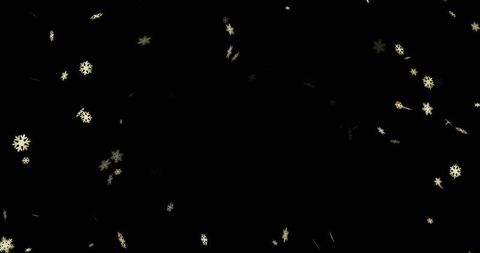 Golden snowflake particles on dark background for elegant celebration