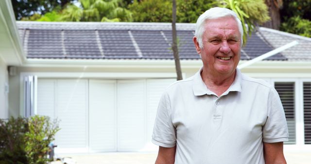 Senior Man Smiling Outside Home with Solar Panels - Download Free Stock Images Pikwizard.com