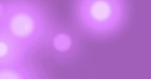 Glowing light spots creating mystic atmosphere on purple backdrop