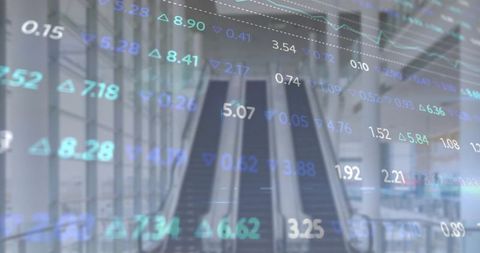 Escalators rising in modern airport atrium displaying financial data overlay