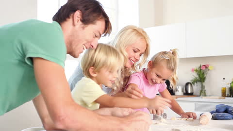Happy Family Enjoying Baking Together in Modern Kitchen